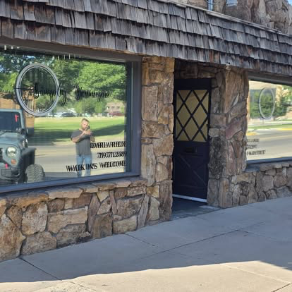 Stone-front storefront with freshly tinted and cleaned display windows