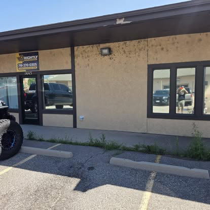 Commercial storefront windows tinted at a Cañon City business on Main