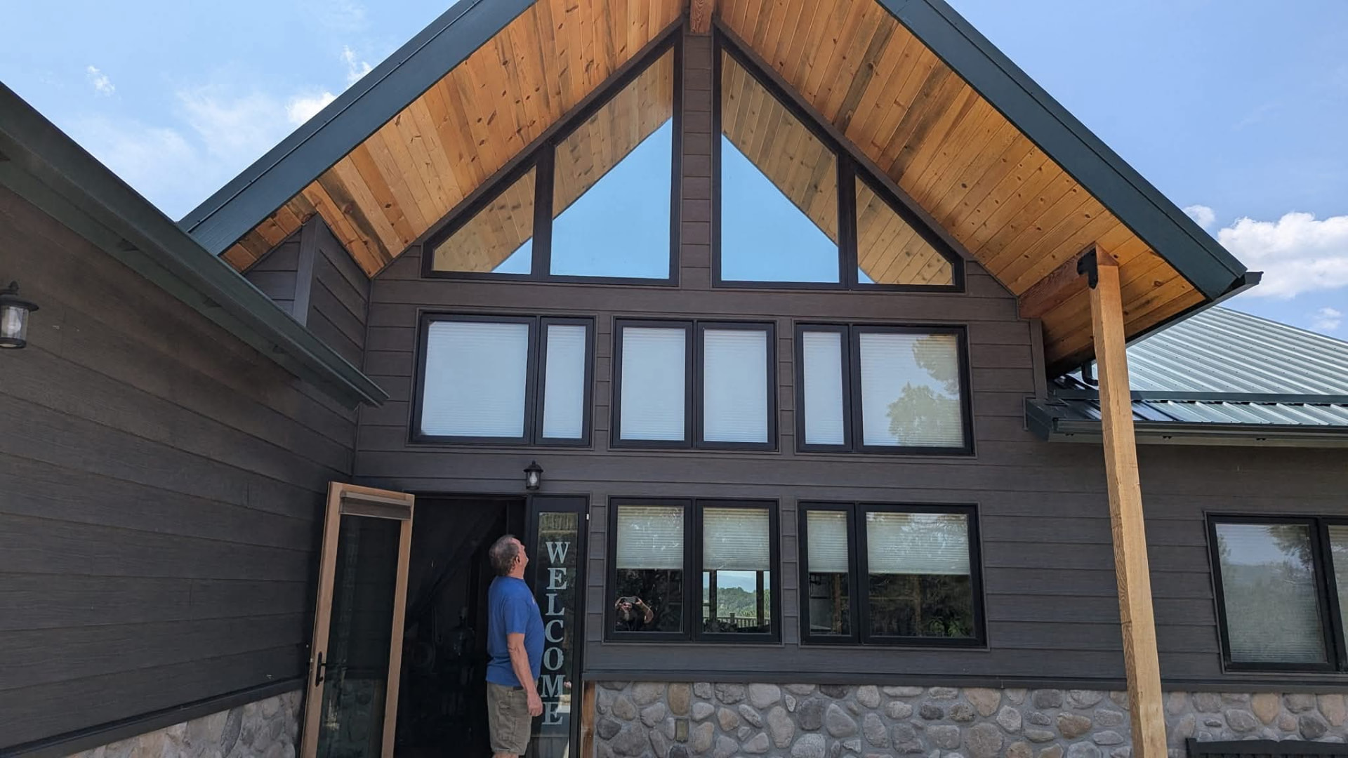 Mountain home with tinted gable and main-level windows to cut heat and glare